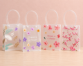 PVC Printed Translucent Gift Bag with Pipe Handle – Premium Reusable Gift Packaging Bag Medium (Mix designs)